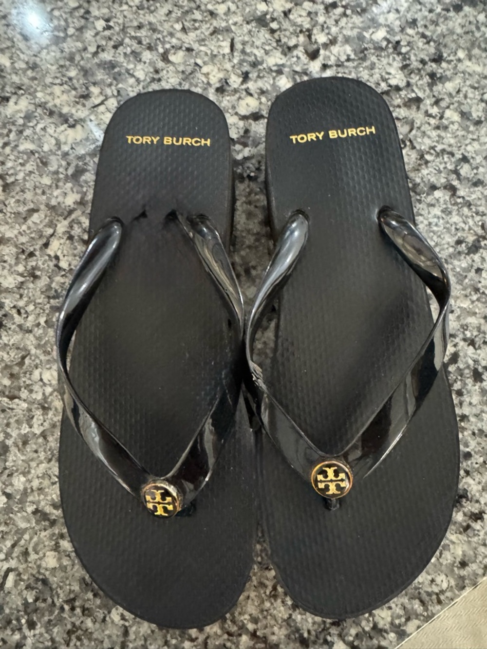 Tory Burch Black Flip Flops with Gold Logo Accent